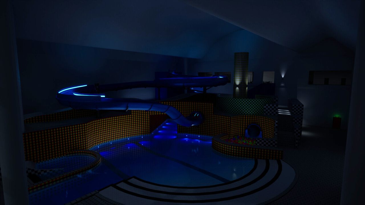 Dimly lit indoor waterpark with a blue-lit water slide and tiled pools